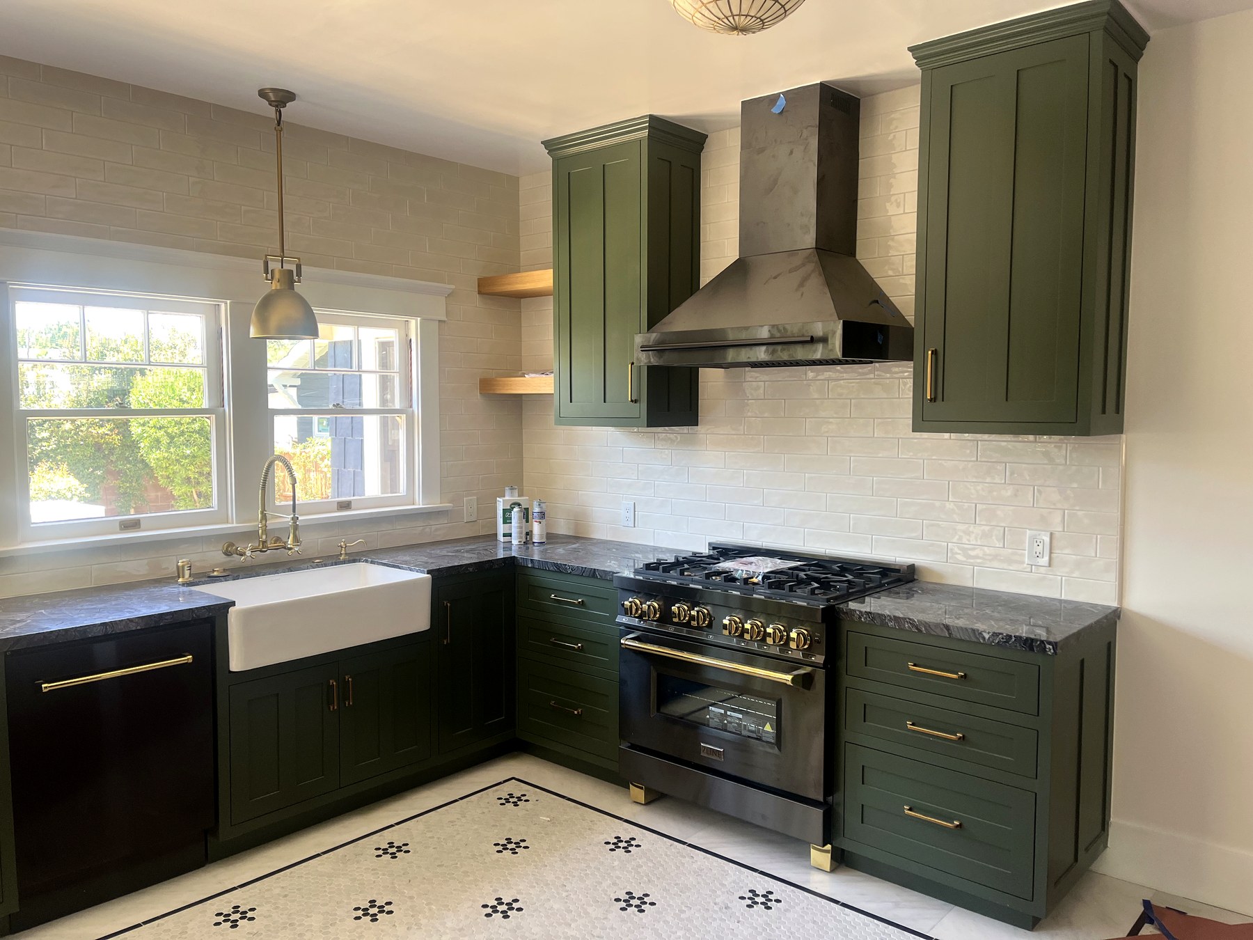 Sage green custom kitchen cabinetry